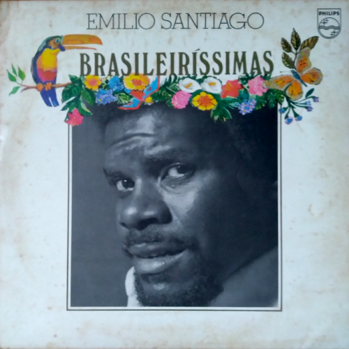 Capa de LP com foto de Emílio Santiago em preto e brancpo no centro. Acima da foto uma ilustração de um tucano e muitas flores coloridas